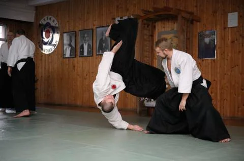 Aikido instructor performing a throw. Aikido seminar Stock Photos