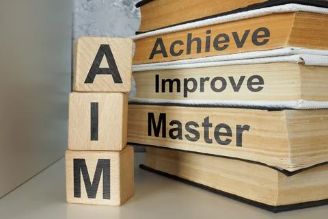 Aim concept with achieve improve master. Personal development symbolism. Stock Photos