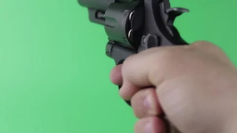 Aim the revolver On Green Screen Background, Chroma Key Stock Footage 150593896