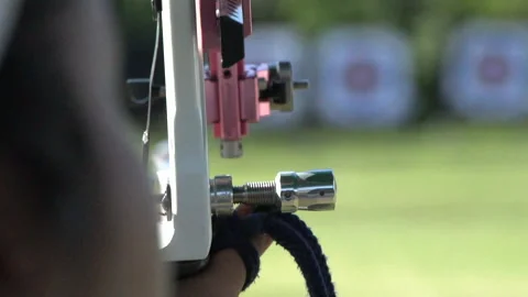 Aiming and shooting during archery target practice, close up slow motion Stock Footage 148646198