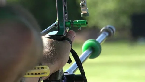 Aiming and shooting a recurve bow, archery target practice, close up slow Stock Footage 148646233