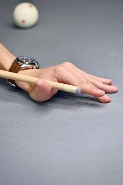 Aiming with a cue stick on a billiard table Stock Photos