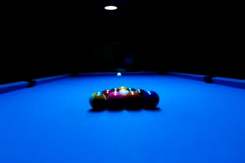 Aiming for an initial kick at the billiard pool table Stock Photos