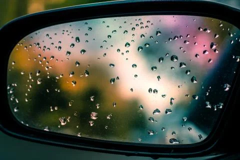 Ain drops on car side view mirror Stock Photos