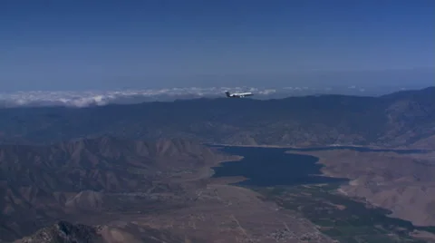 Air-to-air circling view of jet in flight Stock Footage 59476400