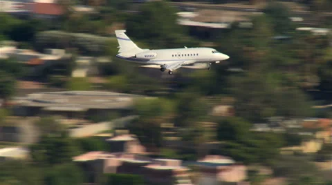 Air-to-air view of executive jet landing Stock Footage 59477881
