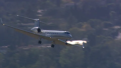 Air-to-air view of executive jet landing Stock Footage 59479606