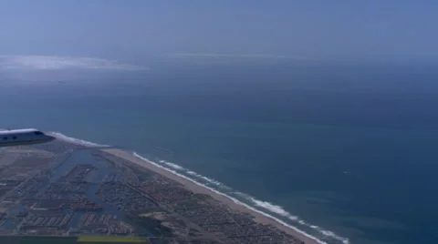 Air-to-air view of jet heading over ocean Stock Footage 59475502