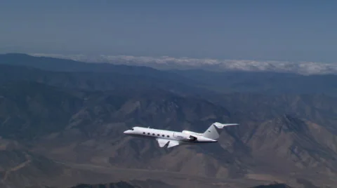 Air-to-air view of oncoming executive jet Stock Footage 59477373