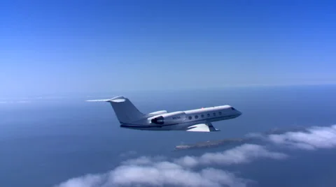 Air-to-air view of small jet over ocean Stock Footage 59475279