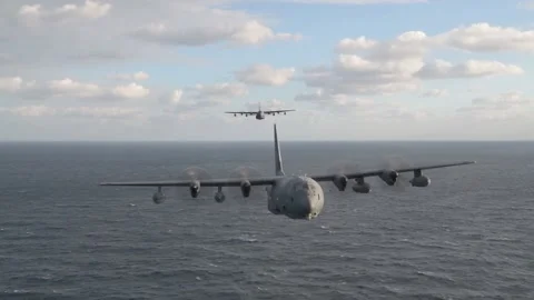 Air to air view of two U.S. Air Force MC-130J Commando II flying over Pacific Stock Footage 229698702