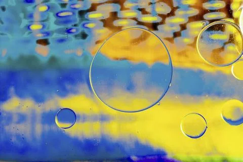 Air and oil bubbles inside water base form patterns Stock Illustration