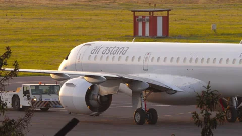 Air Astana Embraer E190-E2 towed at Almaty Airport Stock Footage 338188395