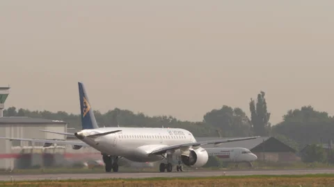 Air Astana Embraer E190-E2 EI-KHE Accelerating on Runway for Takeoff Stock Footage 345093240
