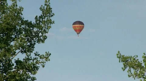 Air balloon behind trees 1 Stock Footage 40975567