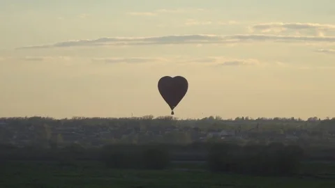 Air balloon fly at sunset Stock Footage 77960385