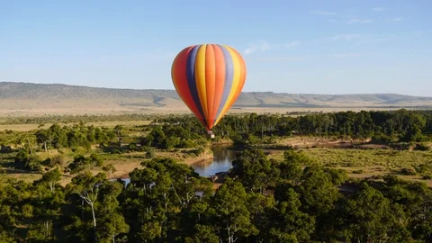 Air balloon flying over river and jungles on the sunset in Kenya, Africa  Stock Footage 106793281