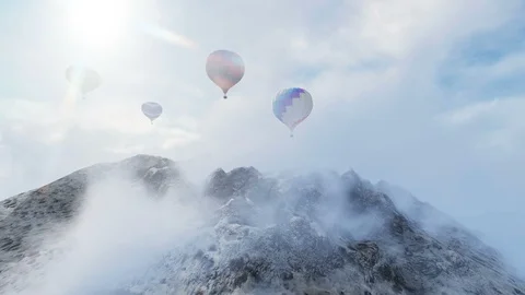 Air Balloon trough clouds over peak mountain Stock Footage 87253043