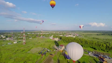 Air Balloons fly above fields at summer day in Pereslavl Zalessky Stock Footage 58497682