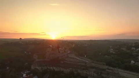 Air balloons flying over Kamianets-Podilskyi Castle in Ukraine Stock Footage 100573653