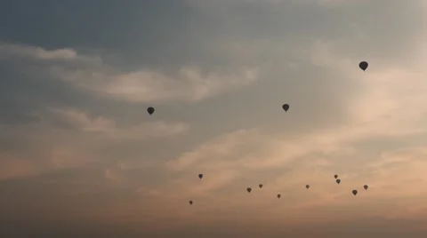 Air Balloons silhouettes hyperlapse in red and blue sky at a sunrise Stock Footage 61030415