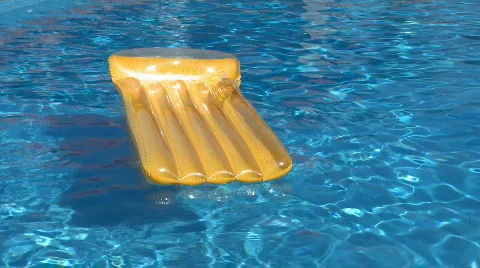 Air bed floating on a swimming pool Video stock 314154