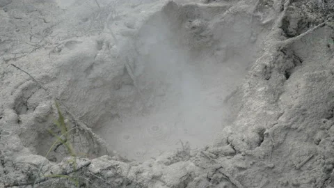 Air bubble eruptions in hot mud, in New Zealand Stock Footage 219980337