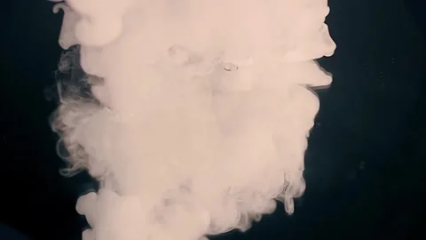 An air bubble filled with smoke explodes spectacularly, forming beautiful cloud Stock Footage 313145387