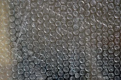 Air bubble wrap close-up. Bubble wrap texture. Stock Photos