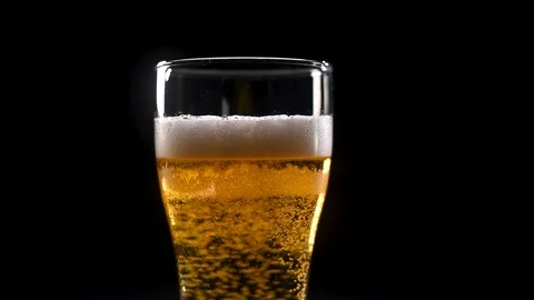 Air bubbles in the beer Stock Footage 123966935
