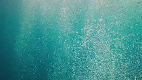 Air Bubbles in the Blue Water Stock Footage 254742216