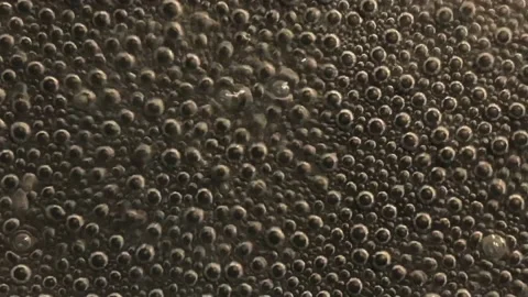 Air bubbles in boiling water Stock Footage 146711339