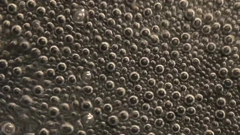 Air bubbles in boiling water Stock Footage 146711535