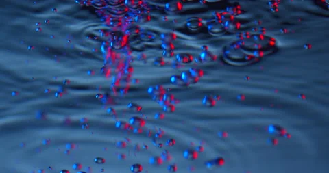 Air bubbles colored in blue and red rising up on blue background. Stock Footage 151644243
