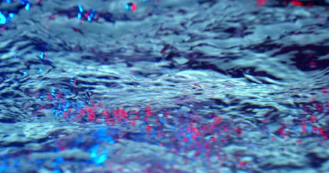 Air bubbles colored in blue and red rising up on blue background. Stock Footage 151644321
