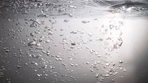 Air bubbles in crystal clear transparent water on a white background Stock Footage 109167344