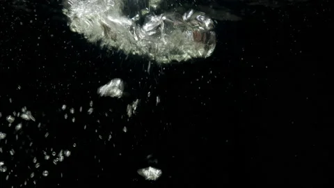 Air bubbles floating under transparent water bubbles in aquarium Stock Footage 157256654