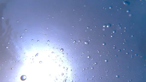 Air bubbles floating up to the water surface. Numerous small bubbles rising up Video stock 111712245