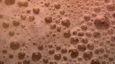 Air bubbles on foam. Random bubbling Stock Footage 160505363