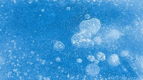 Air bubbles on ice surface, natural texture Stock Photos