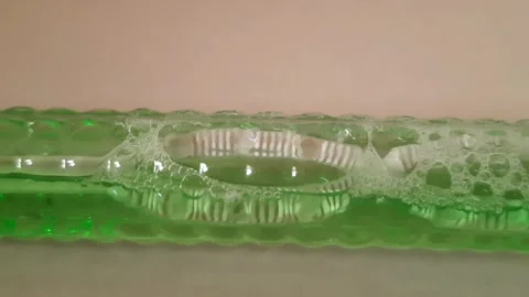 Air Bubbles Moving Through Green Liquid Demonstrating Fluid Motion Stock Footage 342804940