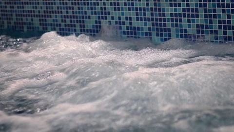 Air bubbles out from jacuzzi jet in a pool Stock Footage 114420096