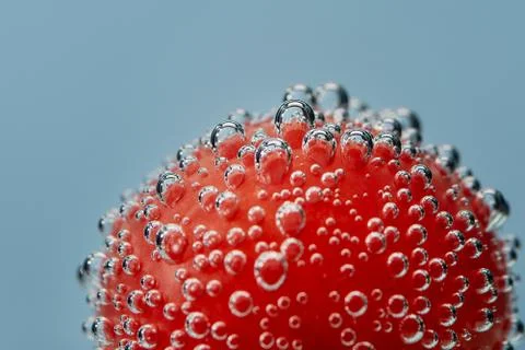 Air bubbles on a red object under water. Stock Photos