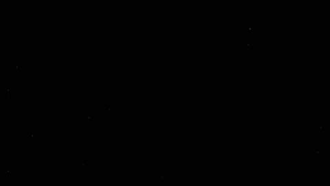 Air bubbles rise up on a black screen. High density of bubbles in the corners of Stock Footage 103555116