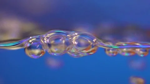 Air bubbles rise to the surface of the water. air bubbles from the side. Boiling Stock Footage 102468163