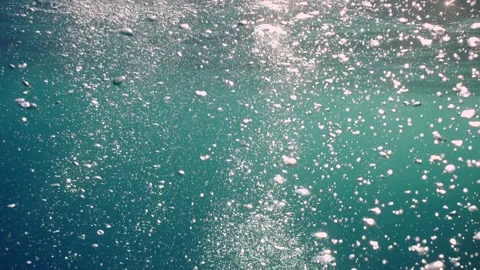 Air bubbles rise up to the surface of the water, slow motion Video stock 234301483