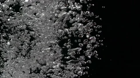 Air bubbles rising in slow motion Stockbeeldmateriaal 232849140