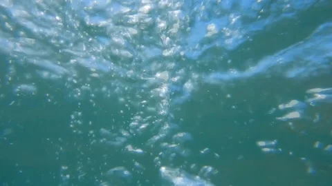 Air bubbles rising up to the surface of the sea seen from underwater Stock Footage 109290920