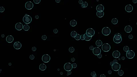Air bubbles smoothly make their ascent against a black background, slightly Video stock 165138146