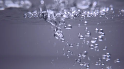 Air bubbles in splashing water, viewed underwater below the surface. Stock Footage 116448909